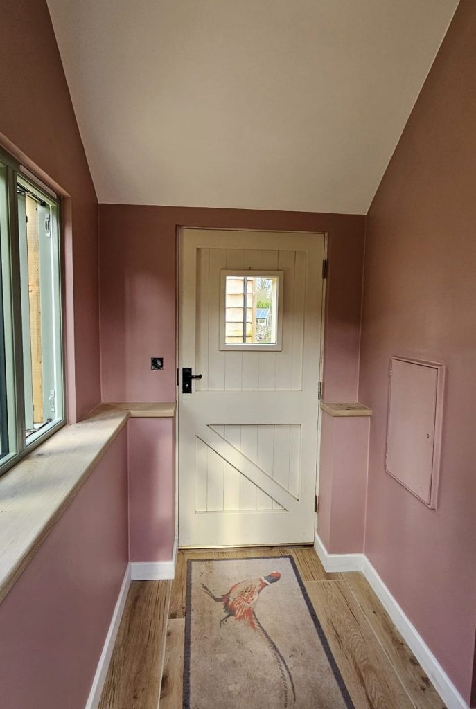 The finished porch interior looking out through the glazed door